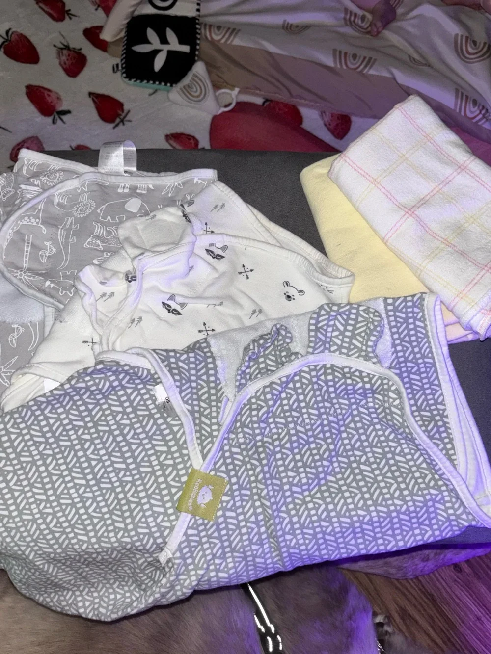 Velcro sleep swaddles and two regular swaddle blankets